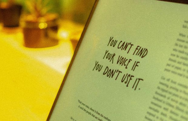 Close-up of a laptop screen displaying text content, representing brand messaging