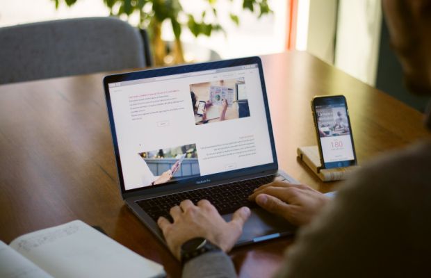Person viewing a fast and secure WordPress website on a laptop