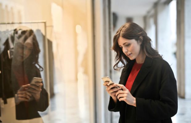 Woman viewing a marketing email on her mobile phone