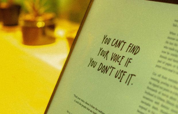 Close-up of a laptop screen displaying text content, representing brand messaging