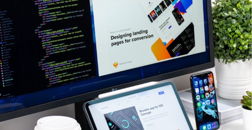 Desktop, laptop, and mobile device displaying websites, representing website management